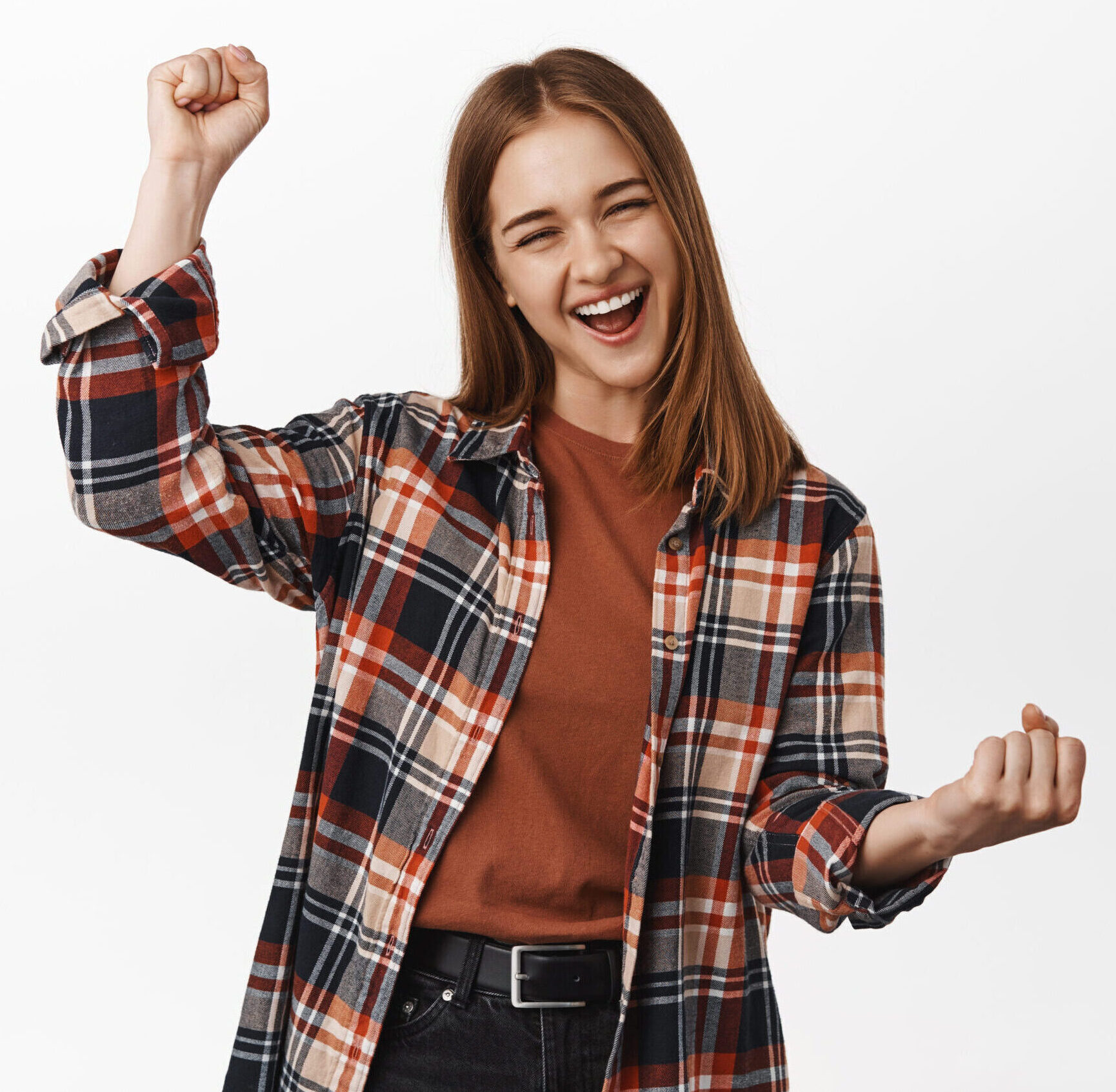 Yes celebrating. Cheerful young woman achieve goal success, scream from joy, fist pump, rooting for team, gain achievement, prize, winning and triumphing, white background.