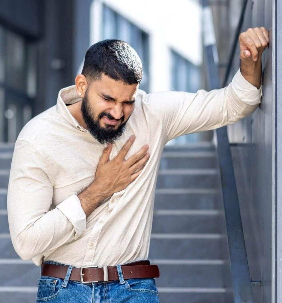 panic-heart-attack-street-young-indian-man-standing-near-building-leaning-against-wall-holding-panic-311682275-transformed